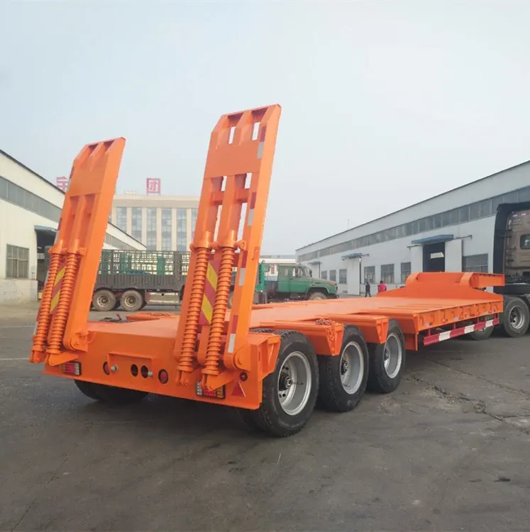 3-axle gooseneck lowboy trailer parked on a yard, front three-quarter view showing the hydraulic ladder and kingpin