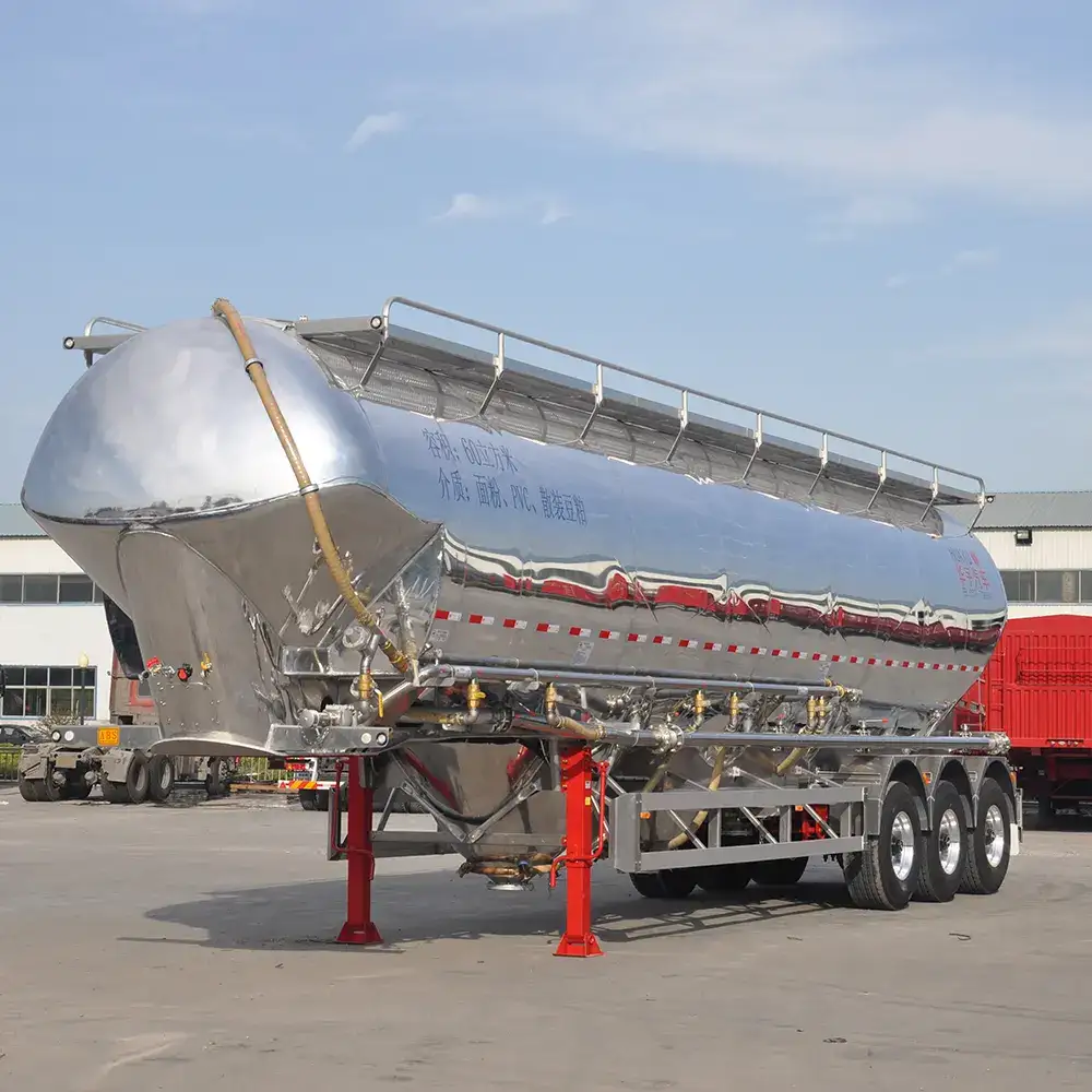 Front three-quarter view of a 3-axle aluminum alloy oil tanker semi-trailer with white tank body and FUWA brand axles