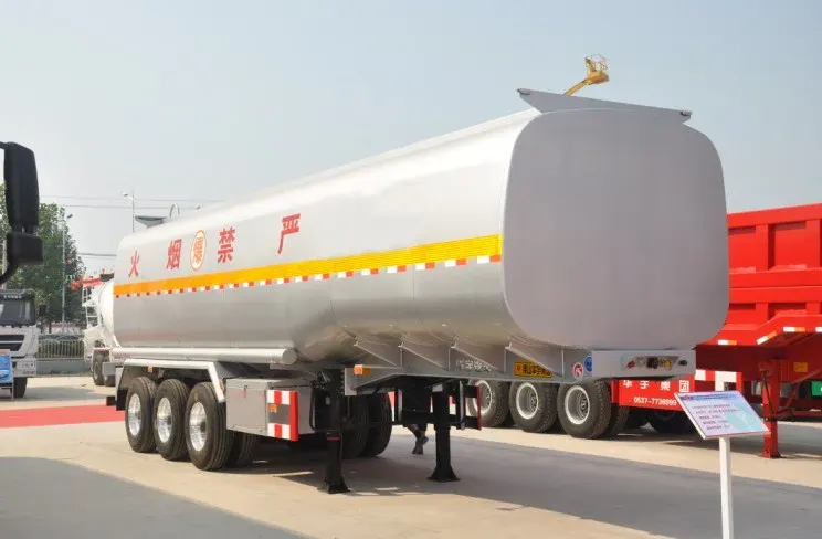 Side view of a 3-axle diesel fuel tank semi-trailer with 12 tyres and mechanical suspension