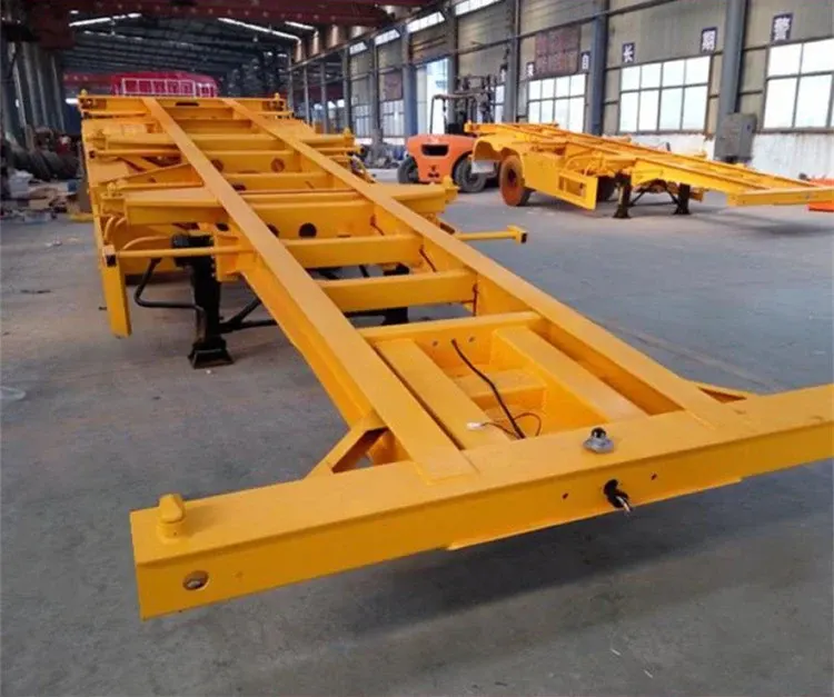 Side view of a 40ft three-axle container flatbed semi-trailer with 12 twist locks and leaf spring suspension