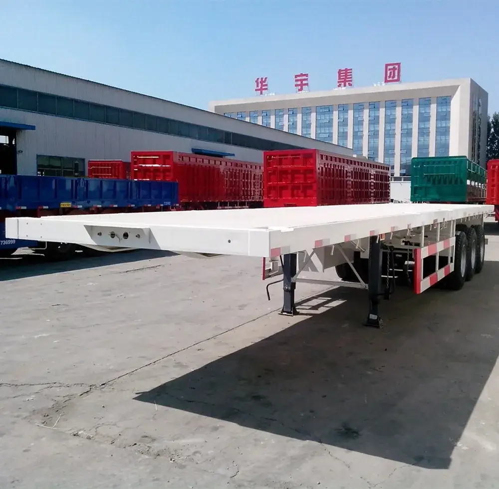 40ft tri-axle flatbed semi trailer in green paint, front three-quarter view with 3 axles visible