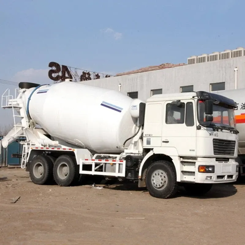 White ZZ1257M3641 6x4 concrete mixer truck parked on a yard, front three-quarter view