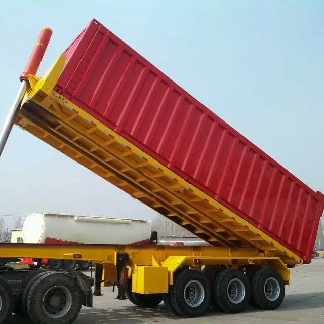 Rear view of a steel rear dump semi trailer with three 13-ton Fuwa axles and hydraulic lift cylinders