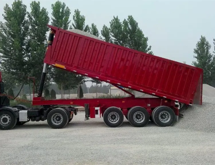 Side view of a 3-axle dump semi trailer with leaf spring suspension and 1200R20 tyres