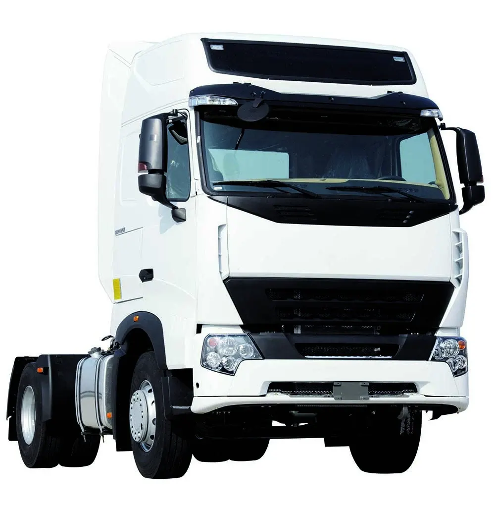 Front three-quarter view of a white HOWO T5G 6x2 tractor head with MAN front axle and ZF steering