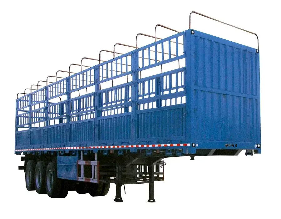 3-axle stake fence semi-trailer parked on a yard, front three-quarter view showing the stake fence and front axle