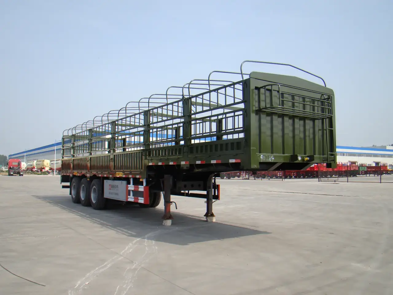 Side view of a 13-meter tri-axle fence semi trailer with three 13-ton Fuwa axles and leaf spring suspension