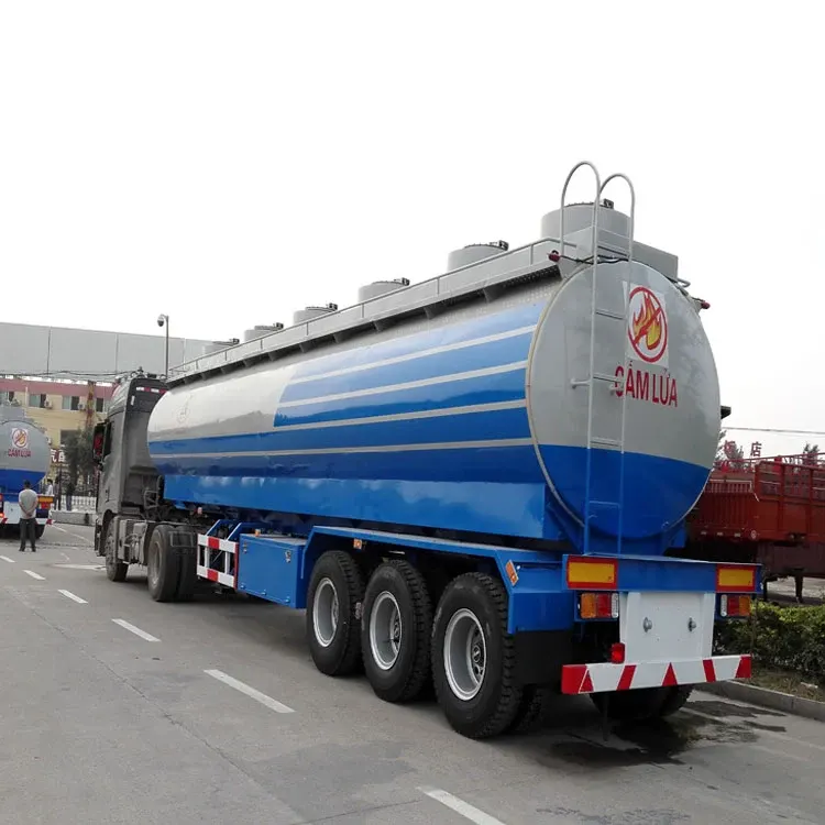 Front three-quarter view of a 3-axle fuel oil tank semi-trailer with stainless steel tank and 12R22.5 tyres