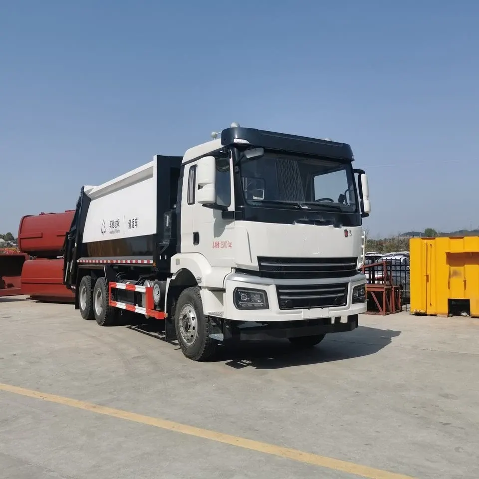 Rear-loading garbage compactor truck parked on a yard, rear view showing compaction mechanism and dumping gear