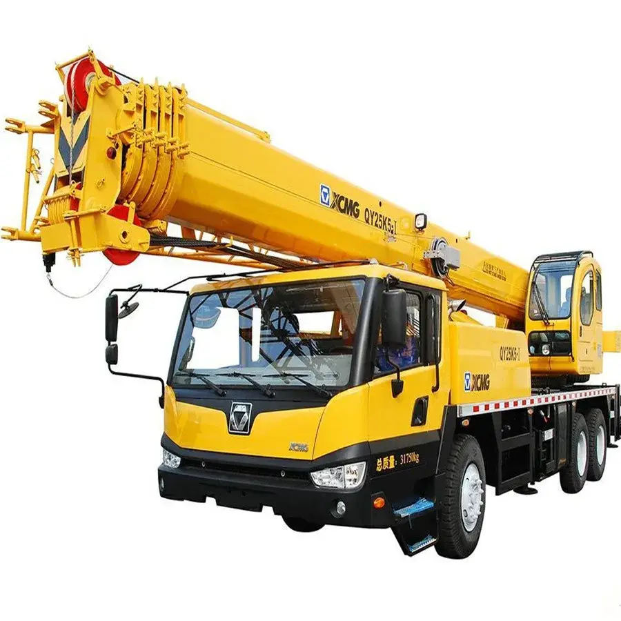 Front three-quarter view of a 25-ton mobile truck crane QY25K-II on a yard, showing the octagonal lifting arm and cab