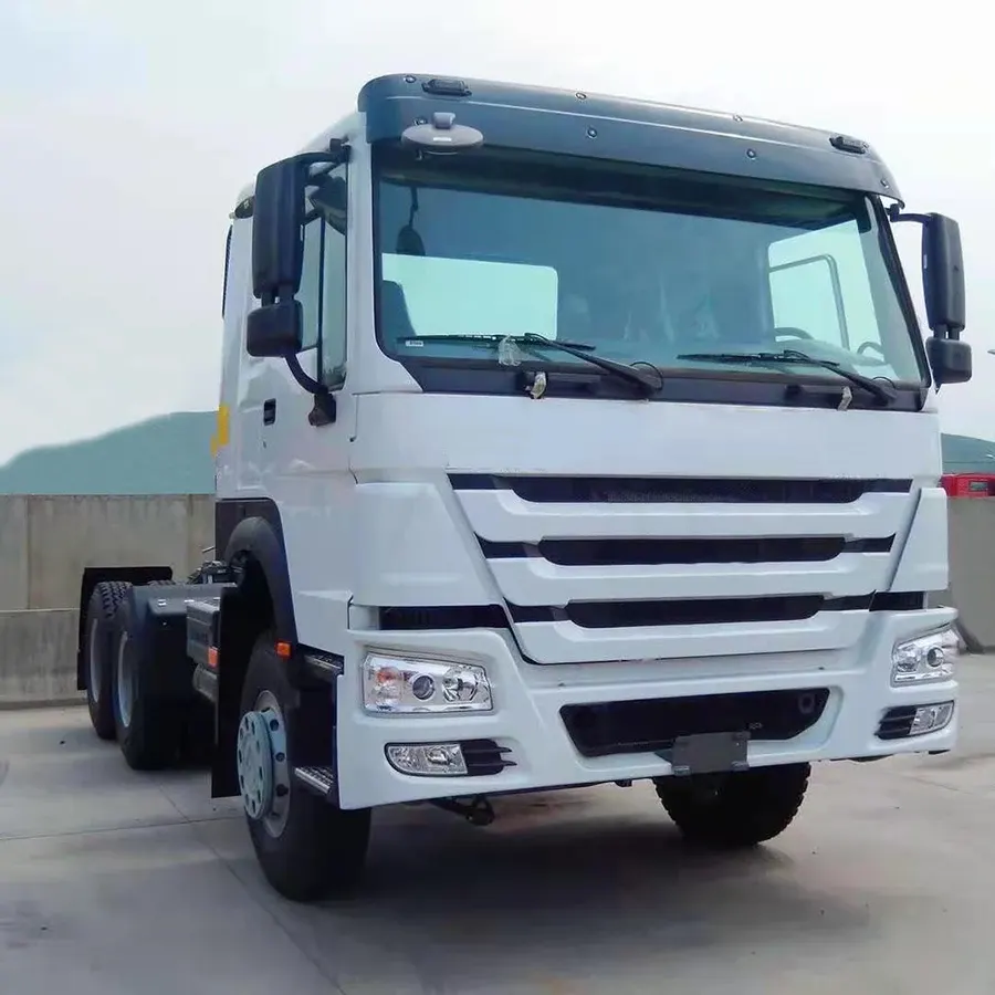 White HOWO V7G 4x2 tractor head parked on a yard, front three-quarter view