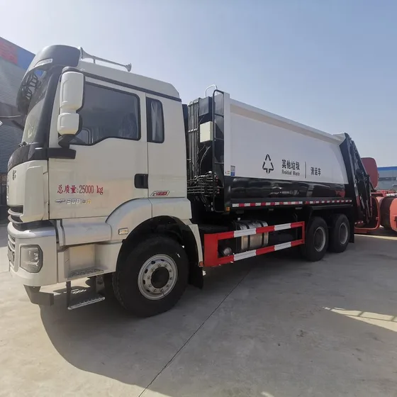 Front three-quarter view of a white HOWO compaction garbage truck with sealed tank and hydraulic system