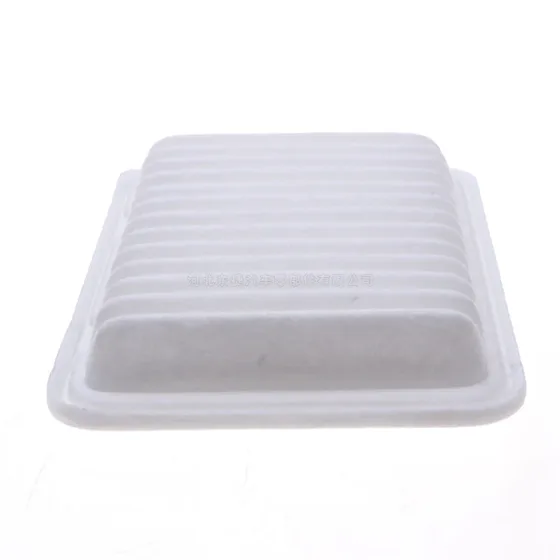 17801-0T020 engine air filter in a white plastic bag, showing the filter body and paper media