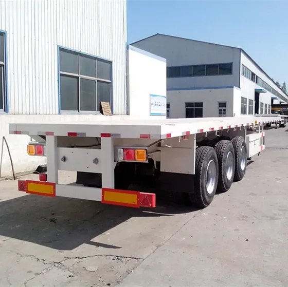 Side view of a 4-axle 40FT container flatbed semi trailer with mechanical suspension and 12R22.5 tyres