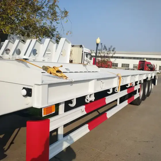 Close-up of the checkered steel floor and 20mm top plate on the trailer deck