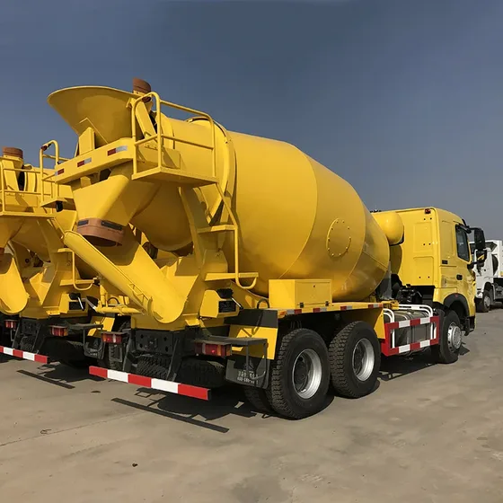 Rear view of the mixer truck with drum discharge mechanism and mud flaps