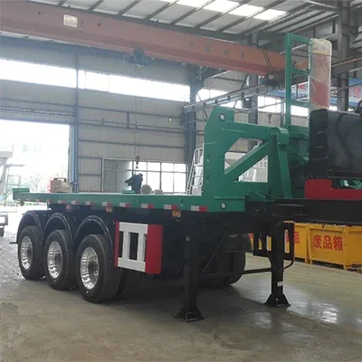2-axle rear dumper semi trailer parked on a yard, front three-quarter view showing dump cylinder and front axle