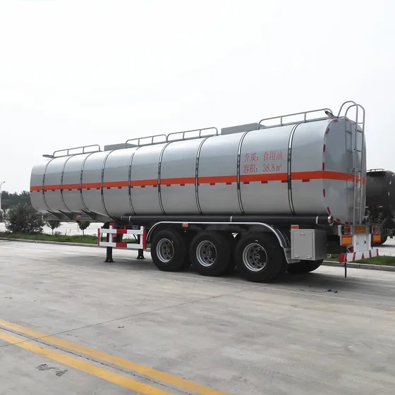 Rear view showing the 4-inch seamless steel discharge pipe, bottom valves, and air brake components