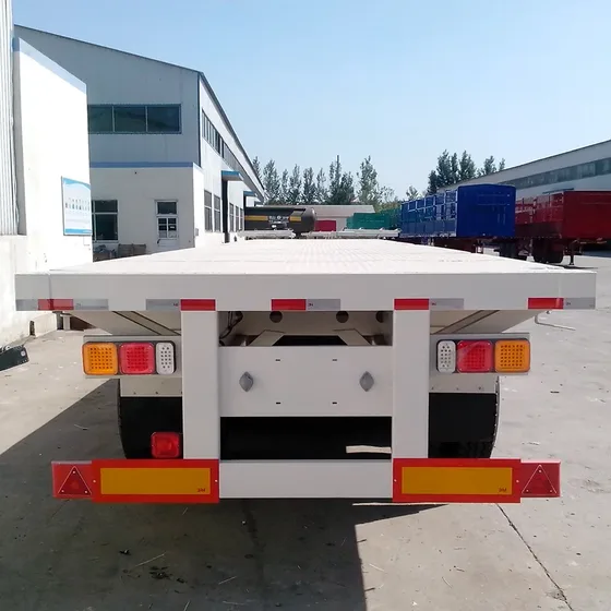 Trailer deck with side walls and twist lock points, showing cargo containment design