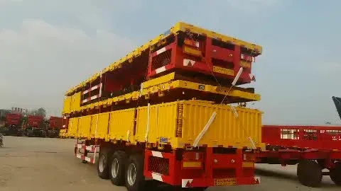 Yellow 3-axle semi-trailer with side boards and twist lock system, front three-quarter view