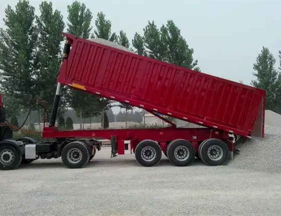 Trailer interior with steel bed and hydraulic lift mechanism in the raised position