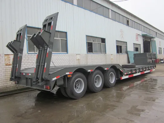 Close-up of the leaf spring suspension and axle mounting on the trailer frame