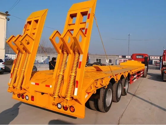 Close-up of the Fuwa axle housing and leaf spring assembly on the trailer's rear axle