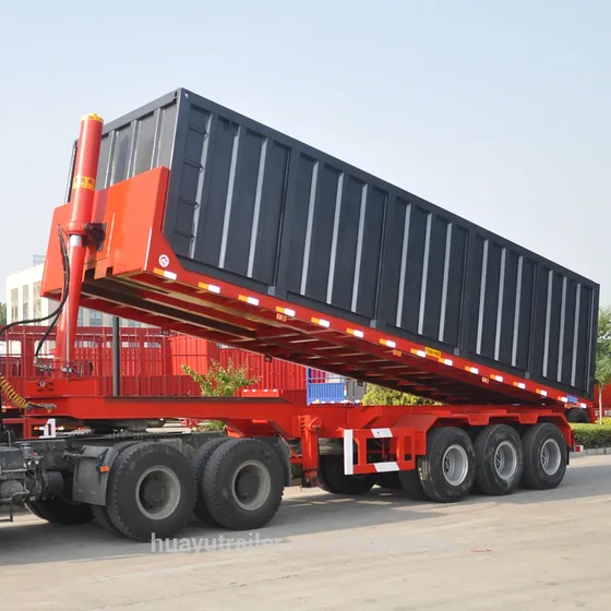 Side view of a 30-60 ton hydraulic rear-tipping semi trailer with three FUWA axles and 11.00R20 tyres