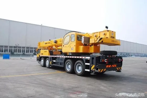 Hydraulic boom system in extended position with jib attached, showing full reach
