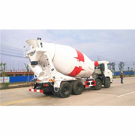 Drum discharge chute and hydraulic pump system on the rear of the truck