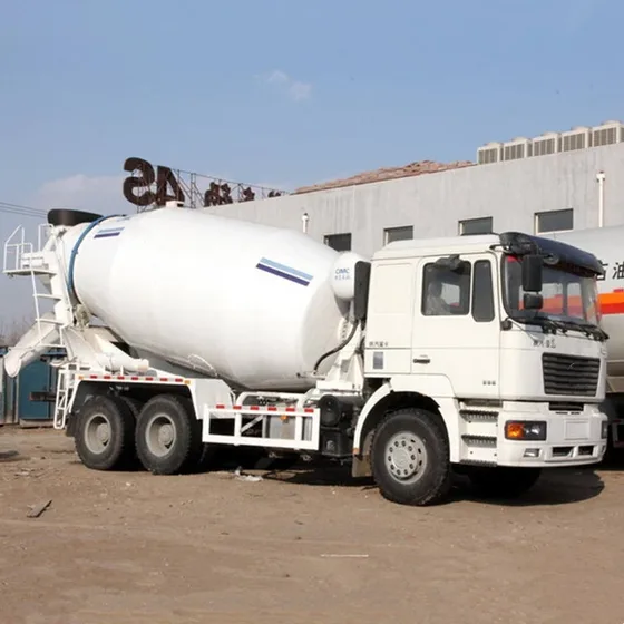 White ZZ1257M3641 6x4 concrete mixer truck parked on a yard, front three-quarter view