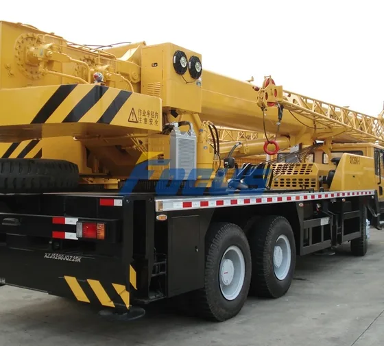 Hydraulic boom system with extension mechanism and cylinder details