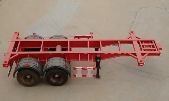 Close-up of the trailer's steel frame and welded joints at the axle mounting points