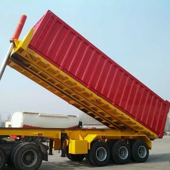 Rear dump semi trailer in white, parked on a yard, front three-quarter view showing 13-ton axles and leaf springs