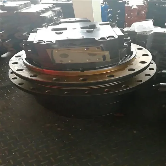 Close-up of the TM50 assembly showing the gear teeth and mounting bolt pattern