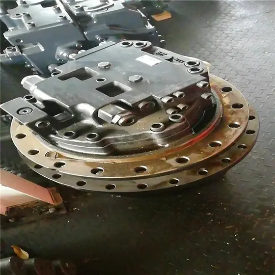 TM50 travel motor assembly with serial number label and packaging details visible