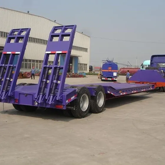 Side view of a 3-axle low bed semi trailer with 1200R20 tyres and leaf spring suspension
