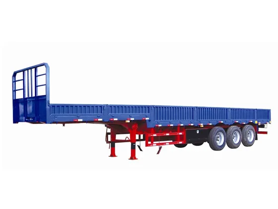 Front view of the trailer showing the drop-side panel and 1200R20 tyres