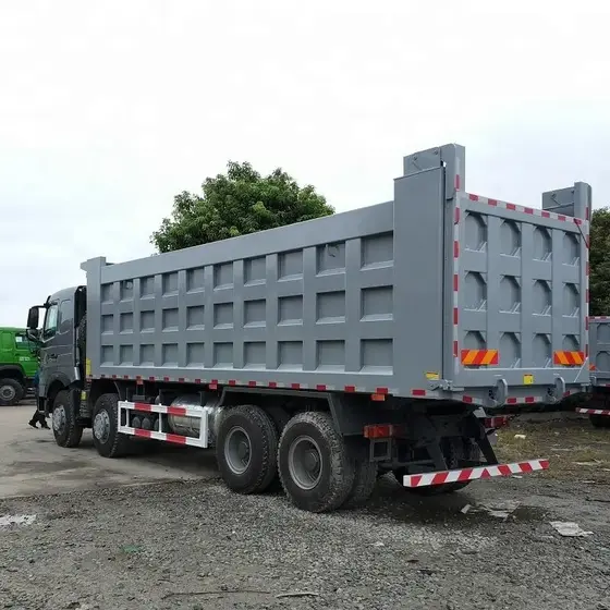 Rear view of the dump truck with hydraulic lift mechanism and cargo body