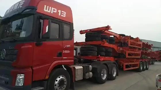 Side view of a 2-axle container skeleton semi-trailer with leaf spring suspension and 1200R20 tyres