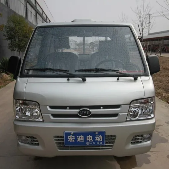 Interior view with two seats, dashboard controls, and steering wheel