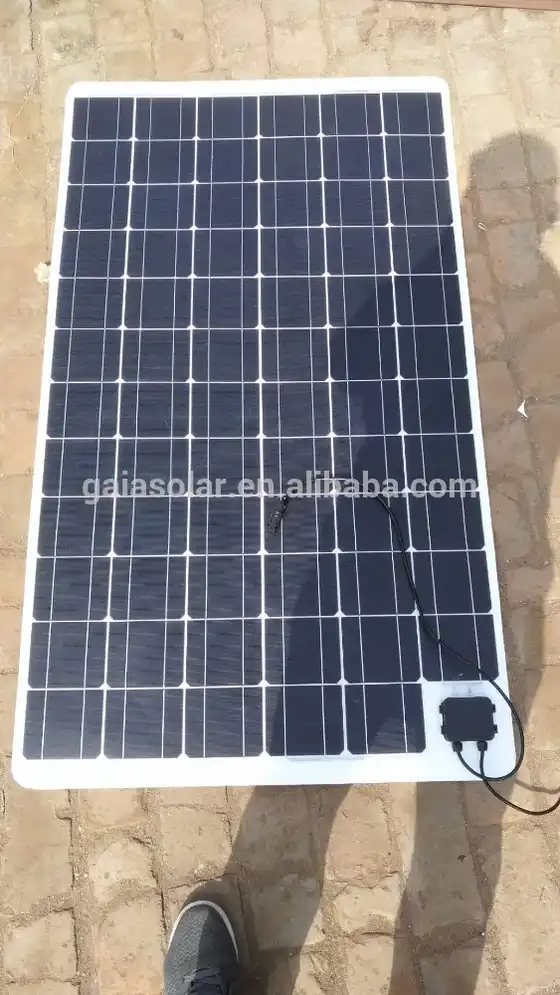 Front three-quarter view of a white 4-wheel solar electric car with solar panel on roof