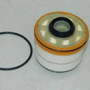 White paper fuel filter 23390-0L010 with 84mm outer diameter, placed on a white background
