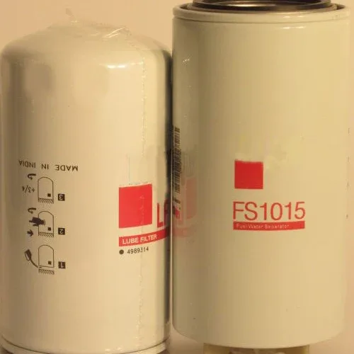 Side view of iron fuel filter and water separator unit FS1015 with threaded inlet and outlet ports