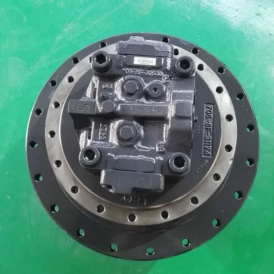 Unit mounted on a PC200-8 excavator track assembly, showing the connection to the travel motor