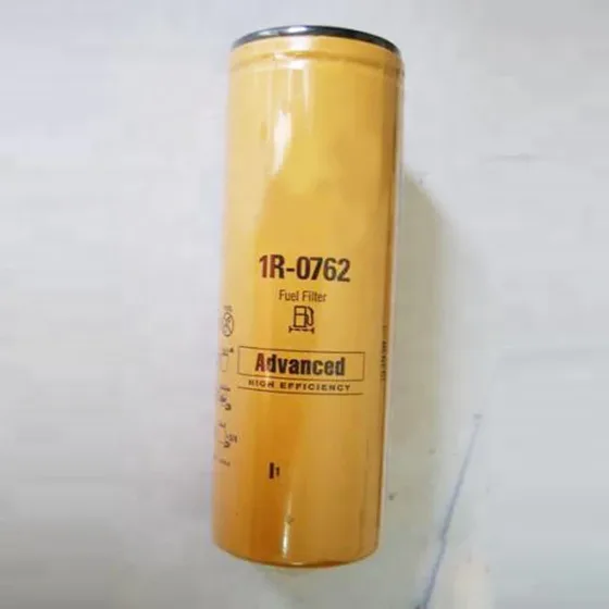 Black iron fuel filter 1R-0762 mounted on a CAT excavator engine, front view