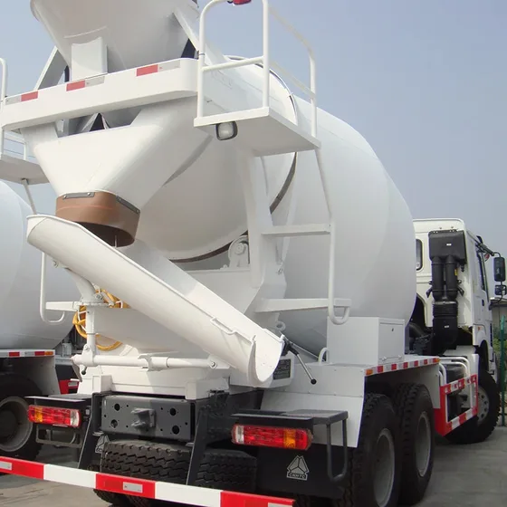 Rear view of the mixer truck with drum, fifth wheel, and mud flaps