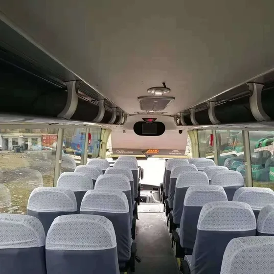 Rear view of the bus with rear doors, tail lights and number plate