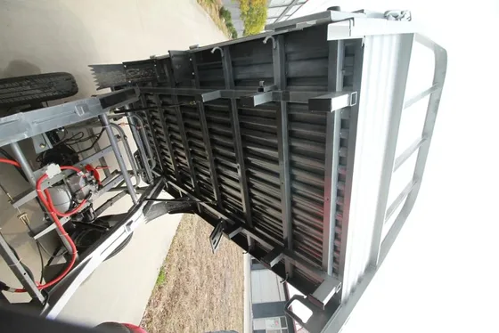 Under-chassis view showing the 72V AC motor and lead-acid battery pack
