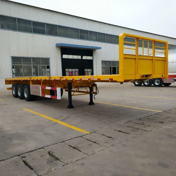 3-axle flatbed semi trailer in white with high bed, front three-quarter view